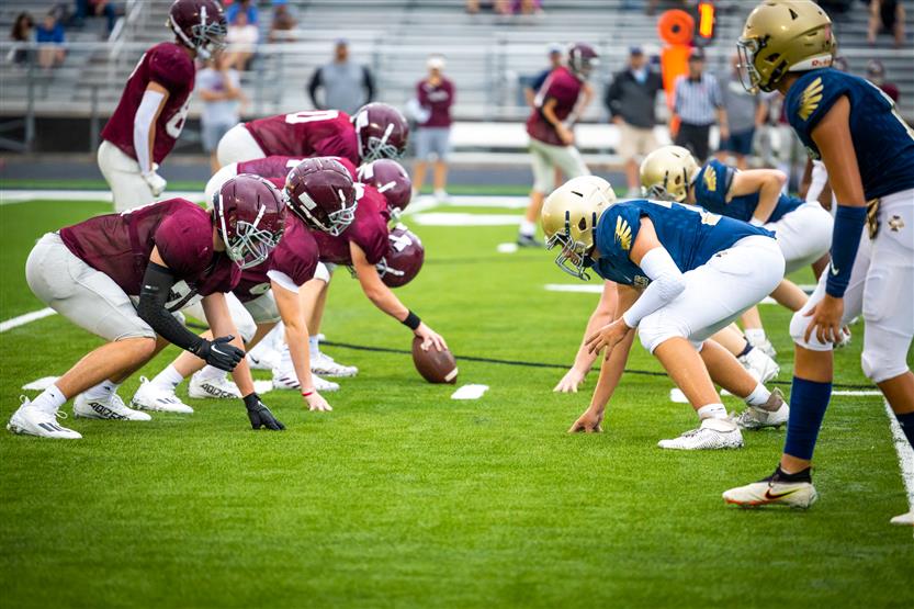 Football teams line up before the play